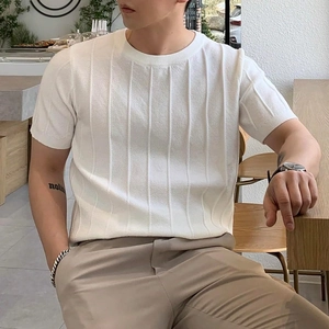 Close-up of men's white short-sleeve knit tee with vertical ribbed texture and crew neck