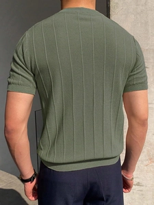 Detail of men's olive green knit t-shirt featuring vertical ribbed texture on the back