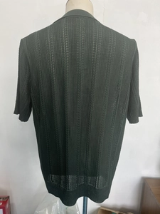 Macro detail of dark green knit polo shirt with breathable hollow vertical mesh texture