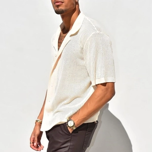 Detailed view of cream short sleeve knit shirt featuring hollow mesh texture and polo collar