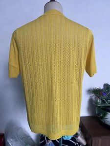 Detailed back view of men's yellow short-sleeved knit shirt with vertical stripe hollow texture