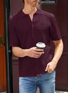 Detailed view of burgundy knit polo shirt with breathable wavy pointelle hollow patterns