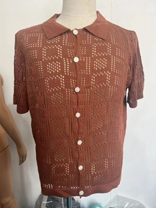 Detail of reddish-brown hollow knit short sleeve polo shirt with white buttons