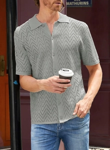 Detail of grey knitted polo shirt featuring a breathable zigzag openwork texture design