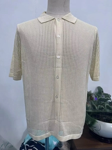 Detail of men's cream open knit short sleeve polo shirt with breathable mesh texture