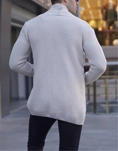 Rear view of men's cable knit cardigan sweater in beige featuring high collar and knit texture