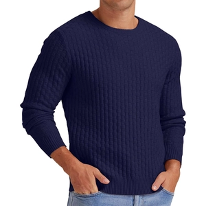Close-up of navy blue men's sweater featuring thick waffle knit texture and ribbed cuffs