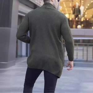 Outdoor shot of the olive green knitted cardigan back view with textured cable knit detail