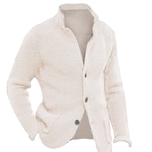 Close-up of beige waffle knit cardigan showing the textured fabric and stand collar