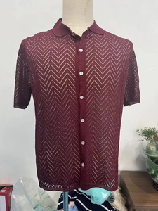 Detail showing the intricate hollow wave knit texture on the burgundy men's polo shirt