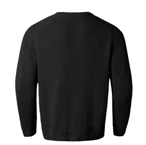 Rear view of black crew neck knit sweater showing thick texture and ribbed finish