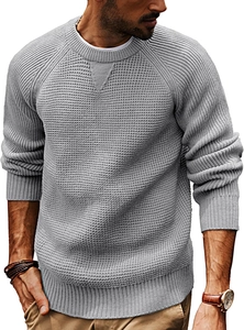 Detail of grey men's crewneck sweater showing textured waffle knit and ribbed cuffs