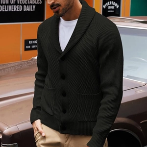 Close-up of black men's knitted cardigan featuring a shawl collar and textured knit details