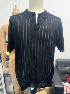 Detail of black mesh knit polo shirt featuring vertical hollow stripes and V-neckline