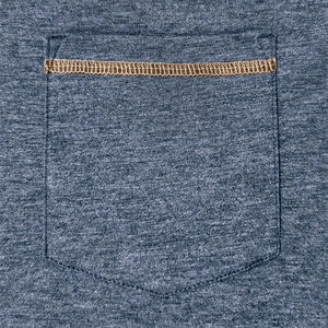 Close-up of heathered blue-grey polo shirt pocket with decorative gold contrast stitching