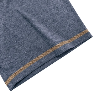 Detailed view of heather grey knit fabric with contrast brown reinforced stitching