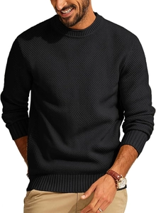 Detailed view of black waffle knit texture and ribbed cuffs on men's crewneck sweater