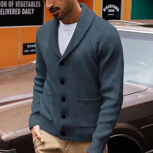 Detailed knit texture and shawl collar of this grey blue men's cardigan on retro street