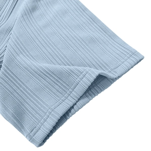 Close-up of ribbed knit cuffs on a light blue polo shirt with premium double stitching