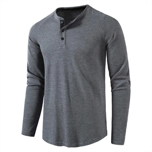 Classic men's charcoal grey waffle knit Henley shirt with long sleeves and buttons