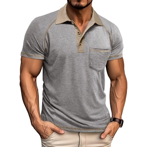 Detail of grey men's polo shirt with contrast collar, raglan sleeves and chest pocket