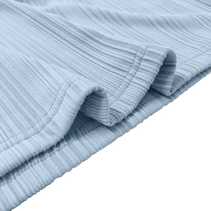 Detail of light blue ribbed knit polo fabric showing high-quality double-needle stitching