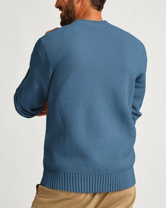 Rear view of a men's waffle knit sweater in fog blue showing detailed diamond texture