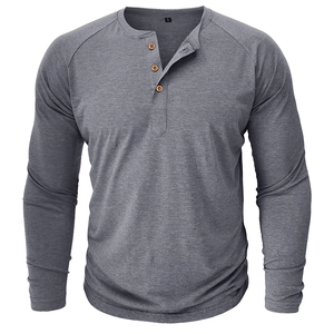 Close-up of dark gray waffle knit Henley collar with three wood-textured buttons