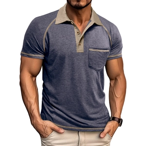 Detailed view of gray-blue polo shirt with khaki contrast stitching and raglan sleeves