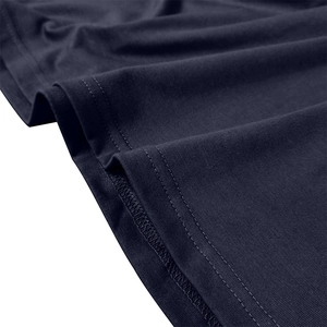 Detail of double-needle stitching and overlock edge on navy blue cotton polo shirt
