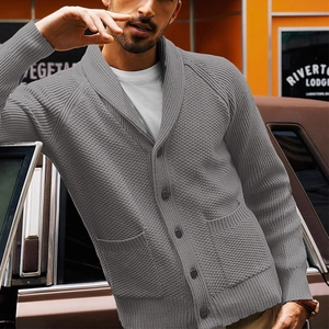 Close-up of men's grey shawl collar cardigan with knit texture and button details