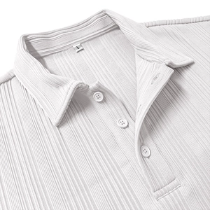 Detail of white polo shirt with vertical textured fabric and size L tag on the collar