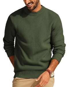 Close-up of olive green waffle knit texture on a men's long-sleeve crewneck sweater