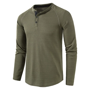 Detailed view of the army green waffle knit texture and three-button henley neckline