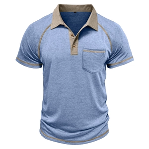 Detail of light denim blue polo shirt with khaki contrast trim and chest pocket