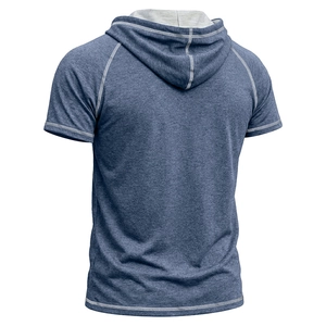 Detail view of heather blue hooded t-shirt with white contrast stitching and raglan sleeves