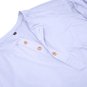 Detailed close-up of light purple long sleeve Henley collar with three dark buttons