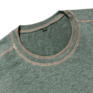 Detail of the crew neck collar with contrast stitching and size label on the grey Henley shirt