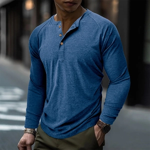 Detail of blue long sleeve Henley shirt with waffle texture and three-button neckline