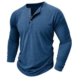 Close-up of raglan sleeves and wooden buttons on the navy blue long sleeve Henley shirt