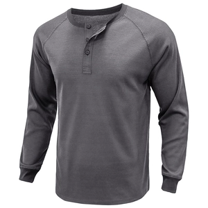 Close-up of dark grey waffle knit fabric with three-button placket and raglan sleeves