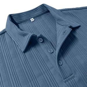 Detail of blue textured polo shirt showing the three-button placket and knit collar