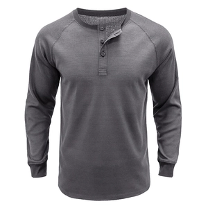 Detailed macro view of dark grey waffle knit fabric and three-button neckline on henley shirt