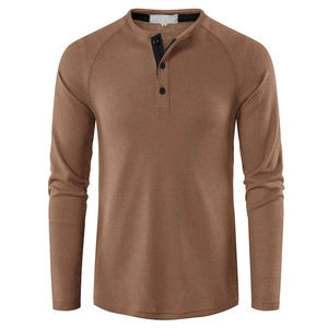 Detail of coffee brown waffle knit henley shirt with three buttons and raglan sleeve design