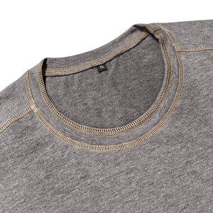Close-up of crew neck stitching on grey Henley T-shirt with contrasting brown thread