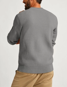Rear view of men's grey waffle knit sweater showing textured fabric and ribbed hem