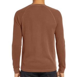 Rear view of men's brown waffle knit long sleeve henley shirt with raglan sleeves