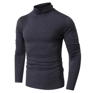 Detailed close-up of dark grey turtleneck t-shirt featuring high-quality heather texture
