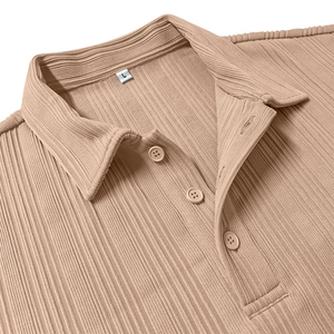 Detail of light beige polo shirt showing ribbed fabric texture and three-button collar