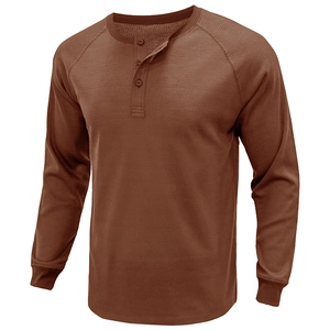 Close-up of deep brown waffle knit fabric and 3-button neckline on a men's Henley shirt